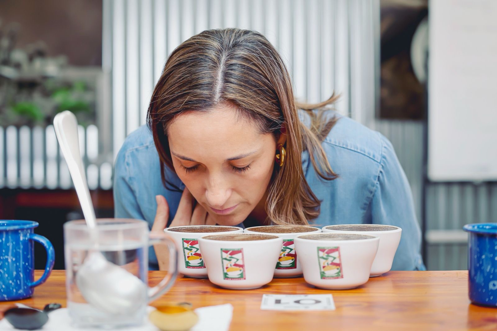 A juror evaluating coffees by smell during a Cup of Excellence cupping session
