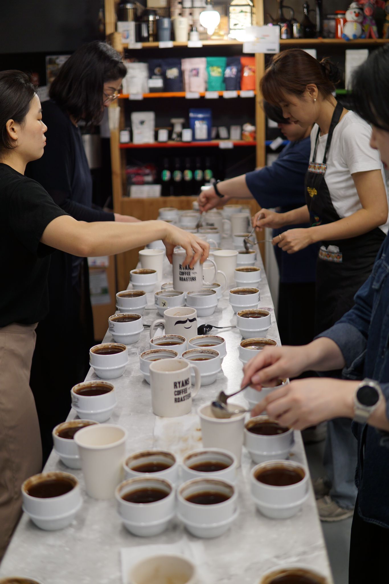ACE member roasters cupping coffees together — evaluating quality lot by lot
